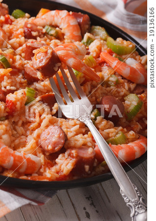 Creole jambalaya close-up on the table. Vertical 19136166