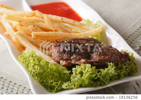 grilled beefsteak with french fries and sauce 19136256