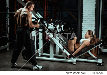 Woman shakes her legs over the bar. Woman shakes her legs over the bar. 19136589