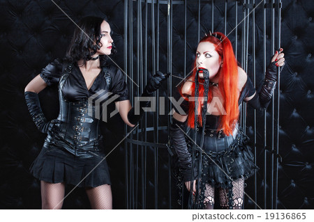 Two women play a dominant game. Two women play a dominant game. 19136865