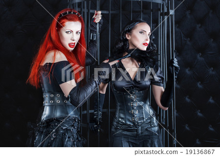 Women dressed in latex and leather dominate the game play. Women dressed in latex and leather dominate the game play. 19136867