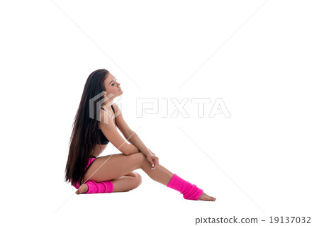 Sport fashion. Pretty brunette in pink gaiters 19137032