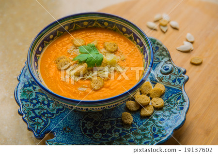 Pumpkin soup puree with spices on a table. 19137602