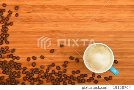 Coffee cup and beans over wood background 19138704