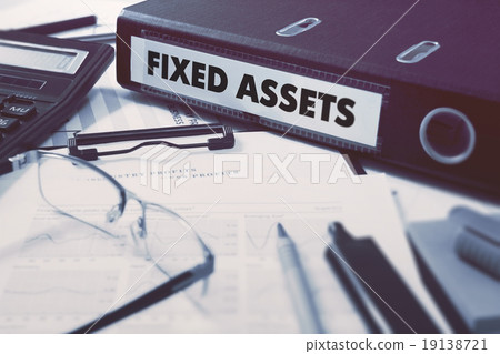 Fixed Assets on Ring Binder. Blured, Toned Image. 19138721