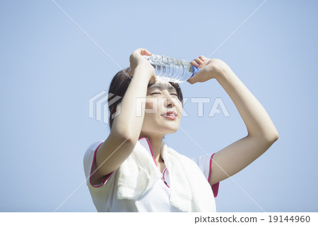 A woman wearing a towel around her neck A woman wearing a towel around her neck 19144960