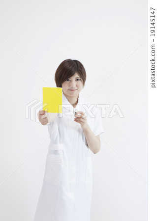 A nurse with a yellow card A nurse with a yellow card 19145147