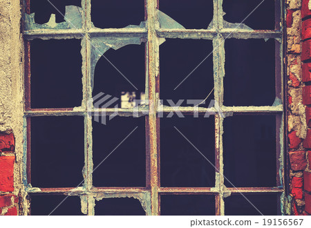 Retro toned old broken window, abstract background Retro toned old broken window, abstract background 19156567