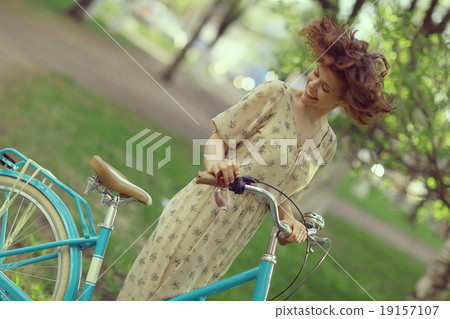 cheerful girl on a bicycle movement cheerful girl on a bicycle movement 19157107