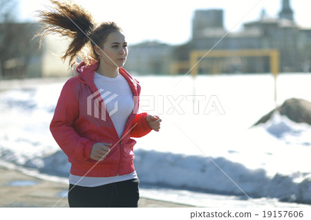 Spring sports running through girl portrait 19157606