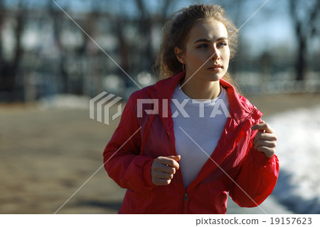 Spring sports running through girl portrait 19157623