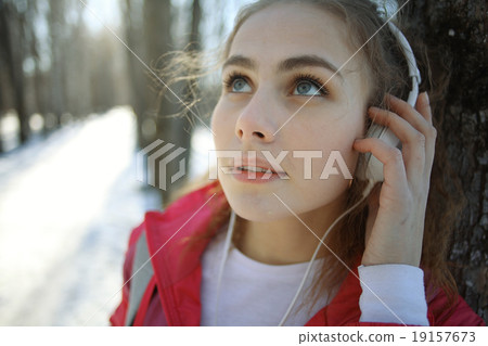 young athletic girl on a walk in the park 19157673