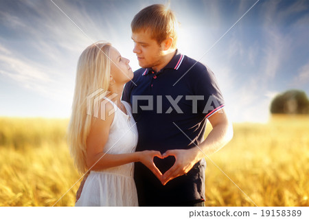 Love at sunset in a wheat field 19158389