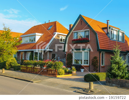 Picturesque residential houses in small Dutch town Picturesque residential houses in small Dutch town 19159722