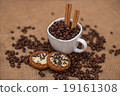 coffee beans cinnamon cookie white cup and saucer  19161308