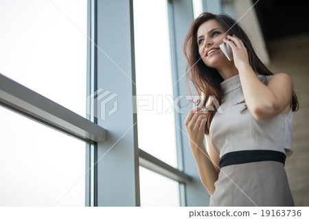 Dark-haired girl in a dress 19163736