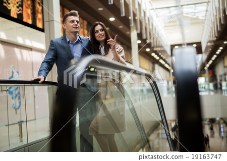 Young couple on the escalator Young couple on the escalator 19163747