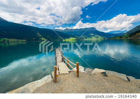 Wooden pier on the mountain lake  19164340