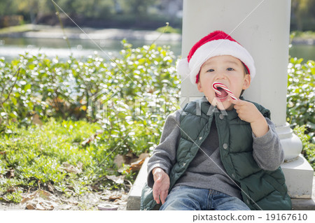 Cute Mixed Race Boy With Santa Hat and Candy Cane Cute Mixed Race Boy With Santa Hat and Candy Cane 19167610