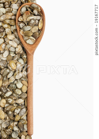wooden spoon with pumpkin seeds 19167717