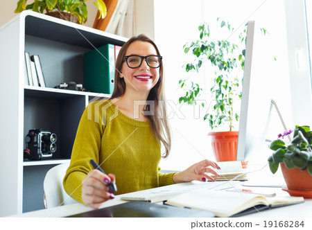 Artist drawing something on graphic tablet at the home office Artist drawing something on graphic tablet at the home office 19168284