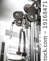 Gym interior close up, machinery and weightlifting 19168471