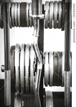 Gym interior close up, machinery and weightlifting 19168480