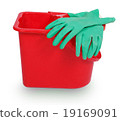 Red plastic bucket and green rubber glove 19169091