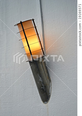 yellow power lamp on the wall, energy details. 19169371