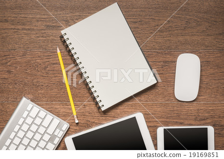 table with notebook, yellow pencil, tablet, keyboa 19169851