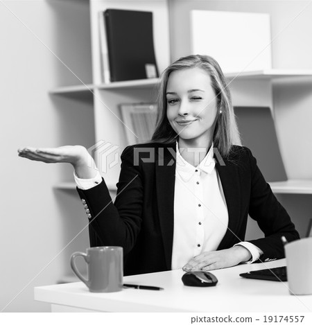 Woman sitting at the desk with computer Woman sitting at the desk with computer 19174557