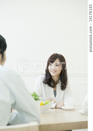 A family surrounding the table A family surrounding the table 19176183