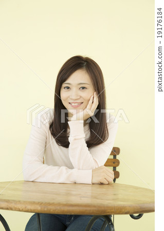 Female in her twenties with her cheeks 19176184