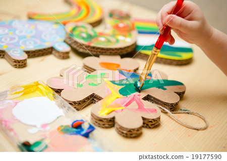 Little female baby painting with colorful paints 19177590