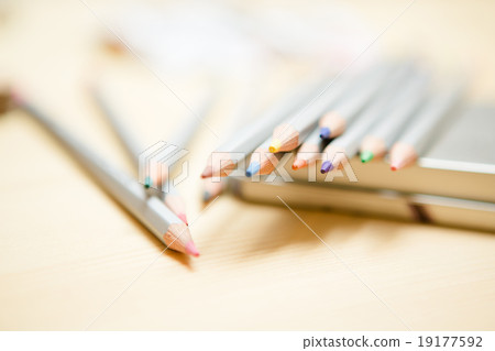 Close up of color pencils over wooden background 19177592