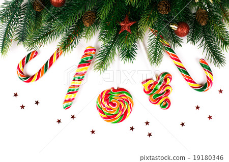 Christmas tree branches with decoration and candy Christmas tree branches with decoration and candy 19180346
