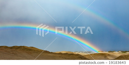 Desert landscape with a colorful rainbow  19183643