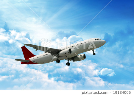 Large passenger plane flying in the blue sky Large passenger plane flying in the blue sky 19184006