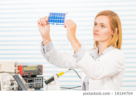 The technician is testing film solar cells 19184704