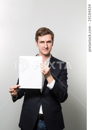 studio shot of businessman with sheet of paper 19184834