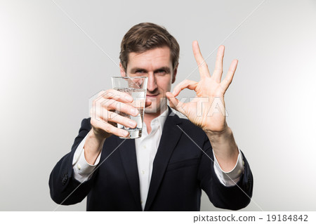 studio shot of businessman with a glas of sparkling water 19184842