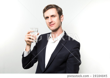 studio shot of businessman with a glas of sparkling water 19184845