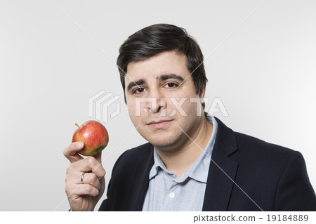 studio shot of successful person and an apple 19184889