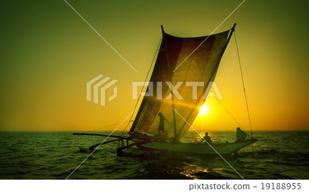 Fishermen on a catamaran at Sunset Concept 19188955