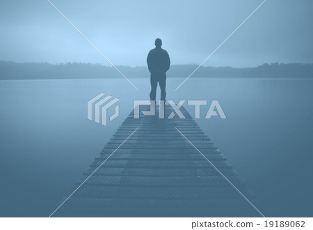 Man Standing Jetty Tranquil Lake Gloomy Fog Dusk Concept Man Standing Jetty Tranquil Lake Gloomy Fog Dusk Concept 19189062