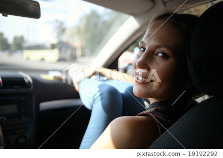 girl in the car on the passenger seat 19192292