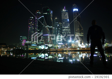 portrait of a man in a night cityscape skyscrapers lights portrait of a man in a night cityscape skyscrapers lights 19192301