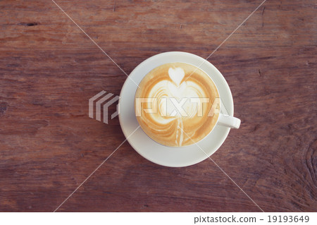 Close up cup of Coffee, latte on the wooden table Close up cup of Coffee, latte on the wooden table 19193649