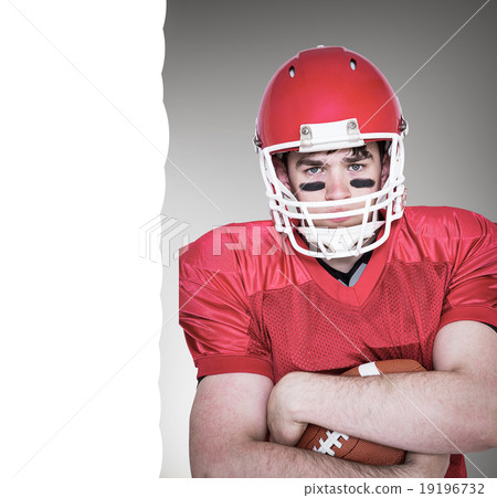Composite image of american football player with arms crossed 19196732