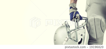 Composite image of close-up of american football player holding Composite image of close-up of american football player holding 19196820